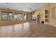 Open-concept living room with fireplace, large windows, and neutral color scheme at 5410 E Gable Ave, Mesa, AZ 85206