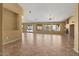 A bright, open living area with tile floors and large windows overlooking a well-maintained backyard at 5410 E Gable Ave, Mesa, AZ 85206