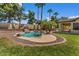 Inviting pool with rock features, providing a serene backyard oasis for relaxation and enjoyment at 5410 E Gable Ave, Mesa, AZ 85206
