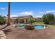 Backyard pool features rock waterfall, spa, and lush landscaping for relaxing outdoor living at 5410 E Gable Ave, Mesa, AZ 85206