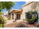 A backyard with brick patio, mature trees, and a patio chair for relaxing at 6734 S Brittany S Ln, Tempe, AZ 85283