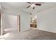Large bedroom featuring neutral carpet and access to the ensuite bathroom at 6734 S Brittany S Ln, Tempe, AZ 85283