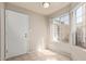 Bright entryway with natural light, tile flooring, and view to the exterior at 6734 S Brittany S Ln, Tempe, AZ 85283