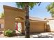 A charming exterior with a gate leading to a courtyard and attached garage at 6734 S Brittany S Ln, Tempe, AZ 85283