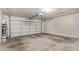 A spacious two-car garage featuring white doors, concrete floor and automatic opener at 6734 S Brittany S Ln, Tempe, AZ 85283