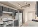 Functional kitchen with neutral countertops, wood cabinets, and appliances at 6734 S Brittany S Ln, Tempe, AZ 85283