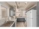 Kitchen with stainless steel sink, tile floors, and gray shaker style cabinets at 6734 S Brittany S Ln, Tempe, AZ 85283