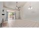 Spacious living room with a fireplace, sliding glass door and ceiling fan at 6734 S Brittany S Ln, Tempe, AZ 85283