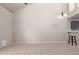 Open living room with tile floors, high ceilings, and modern chandelier at 6734 S Brittany S Ln, Tempe, AZ 85283
