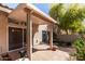A covered outdoor patio area with brick flooring and access to backyard at 6734 S Brittany S Ln, Tempe, AZ 85283