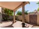 A covered outdoor patio area with brick flooring and privacy landscaping at 6734 S Brittany S Ln, Tempe, AZ 85283