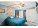 Serene bedroom showcases an overhead fan, bright natural light, and ample closet space at 690 S 92Nd Pl, Mesa, AZ 85208