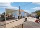 Charming exterior of a blue home with a covered patio and a spacious gravel yard at 690 S 92Nd Pl, Mesa, AZ 85208