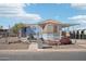 Charming single-story home featuring a fenced yard and covered parking at 690 S 92Nd Pl, Mesa, AZ 85208