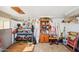Spacious garage with workbench, wooden cabinets and miscellaneous tools and equipment at 690 S 92Nd Pl, Mesa, AZ 85208