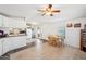 Open kitchen and dining area with tile floors and bright lighting at 690 S 92Nd Pl, Mesa, AZ 85208
