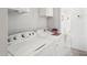 Efficient laundry room features appliances and functional space at 690 S 92Nd Pl, Mesa, AZ 85208