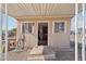 Exterior of the shed with windows, an open doorway, and a wooden landing at 690 S 92Nd Pl, Mesa, AZ 85208