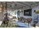 Back porch with comfortable seating, wind chimes, and a view of the yard at 6913 W Wilshire Dr, Phoenix, AZ 85035