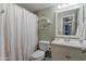Bathroom featuring tiled floors, a shower and tub, and vanity sink at 6913 W Wilshire Dr, Phoenix, AZ 85035