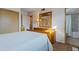 Bedroom with a wooden dresser, mirror, and access to bathroom at 6913 W Wilshire Dr, Phoenix, AZ 85035