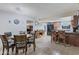 Inviting dining area flows into the kitchen, featuring a breakfast bar and ample cabinet space at 6913 W Wilshire Dr, Phoenix, AZ 85035