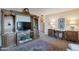 Inviting living room with a wooden entertainment center and plenty of room for relaxing and socializing at 6913 W Wilshire Dr, Phoenix, AZ 85035