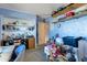 Functional office space with built-in shelving and abundant storage at 6913 W Wilshire Dr, Phoenix, AZ 85035