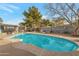 Inviting pool with blue water, a patio, and outdoor seating at 6913 W Wilshire Dr, Phoenix, AZ 85035