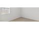 Simple bedroom with carpet, a window providing natural light, and fresh, white walls at 7425 W Buckhorn Trl, Peoria, AZ 85383