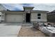 New single-story home features a two-car garage, neutral stucco, and a covered porch area at 7425 W Buckhorn Trl, Peoria, AZ 85383