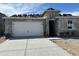 View of the exterior of a single-Gathering home with a two-car garage at 7425 W Buckhorn Trl, Peoria, AZ 85383