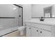 Clean bathroom featuring a walk-in shower, white cabinets and vanity, and modern fixtures at 7664 W Minton St, Laveen, AZ 85339