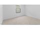 Bright, neutral bedroom features a window, plush carpet, and ample natural light at 7664 W Minton St, Laveen, AZ 85339