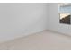 Bright, neutral bedroom features a window, plush carpet, and ample natural light at 7664 W Minton St, Laveen, AZ 85339