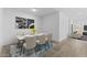 Stylish dining room featuring modern decor, a beautiful bouquet, and contemporary furnishings at 7664 W Minton St, Laveen, AZ 85339