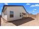 Exterior view of the home showcasing its architectural design and private backyard at 7664 W Minton St, Laveen, AZ 85339