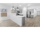 Spacious kitchen with gray cabinets, stainless steel appliances, and a bright white quartz countertop at 7664 W Minton St, Laveen, AZ 85339