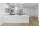 Bright, airy kitchen with sleek gray cabinetry, stainless steel appliances, and a spacious quartz countertop at 7664 W Minton St, Laveen, AZ 85339