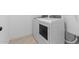 Functional laundry room with modern washer and dryer for convenient chores at 7664 W Minton St, Laveen, AZ 85339