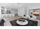 Bright living room features modern furnishings, sleek flooring, and an open floor plan to kitchen at 7664 W Minton St, Laveen, AZ 85339