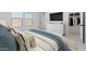 Comfortable bedroom with a cozy bed, modern furniture, and bright windows at 7664 W Minton St, Laveen, AZ 85339