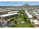 Aerial view showcasing the complex's golf area, residential buildings, and scenic landscape at 7840 E Camelback Rd # 111, Scottsdale, AZ 85251