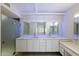 Stylish bathroom featuring double sinks, vanity, large mirror, and accent lighting at 7840 E Camelback Rd # 111, Scottsdale, AZ 85251