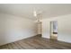 Bright, spacious bedroom with new flooring and a ceiling fan at 7840 E Camelback Rd # 111, Scottsdale, AZ 85251