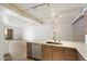 Modern kitchen with stainless steel appliances and an open layout to the living room at 7840 E Camelback Rd # 111, Scottsdale, AZ 85251