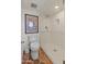 Bathroom featuring walk-in shower, white toilet, and decorative tile accents at 7921 N 54Th St, Paradise Valley, AZ 85253