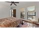 Comfortable bedroom with neutral tones, large windows, and tiled floors at 7921 N 54Th St, Paradise Valley, AZ 85253