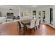 Bright dining room with tile floors and access to the outdoor pool area at 7921 N 54Th St, Paradise Valley, AZ 85253