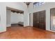 Grand foyer with terra-cotta floors, wooden beams, and decorative double doors at 7921 N 54Th St, Paradise Valley, AZ 85253